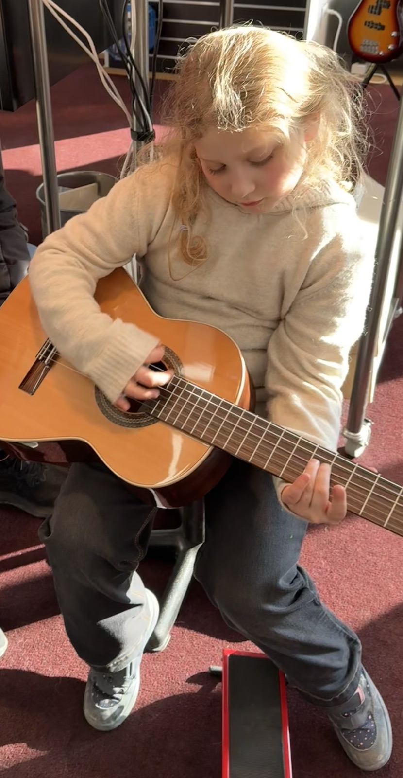 Mathilde playing guitar