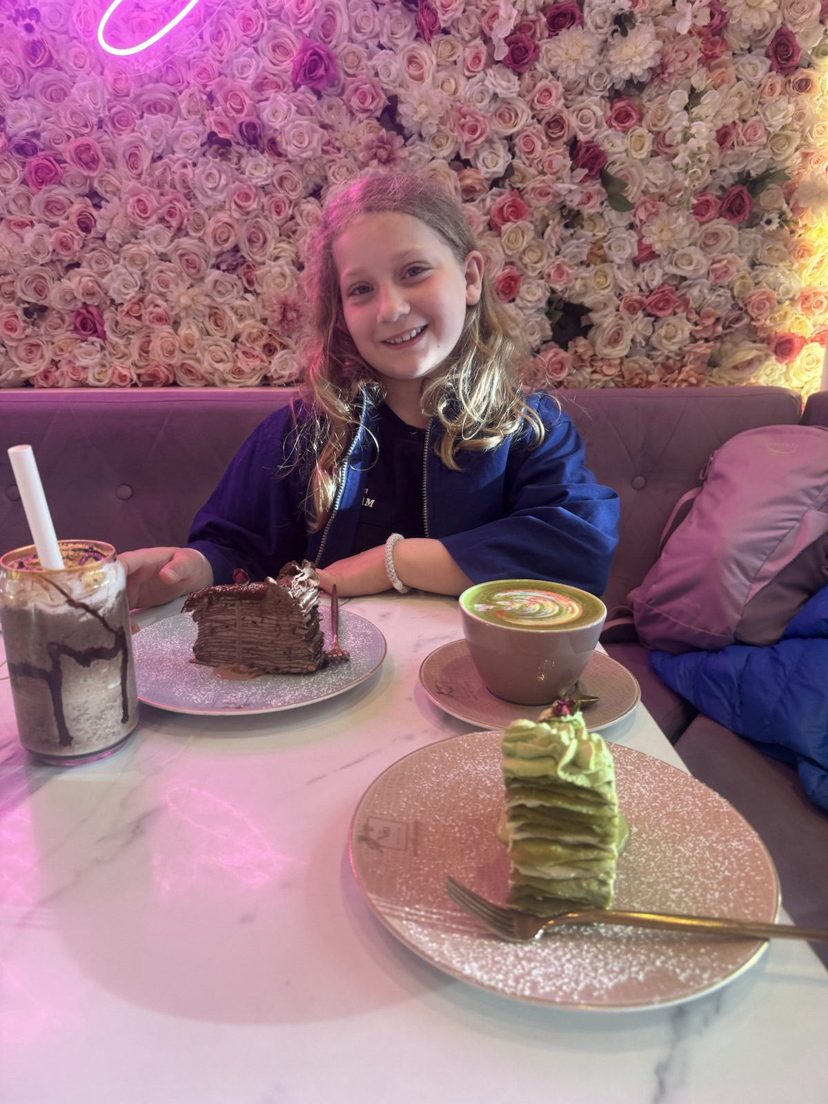Mathilde with cake and a milkshake