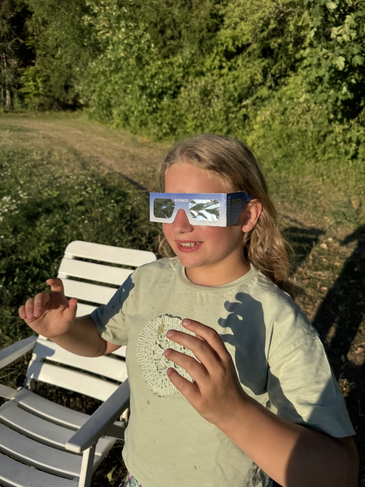 Mathilde wearing solar eclipse glasses